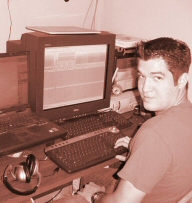 This is me at my workstation. There are 3 computers at this one desk but I am using only 1 in this photo (but 2 screens).